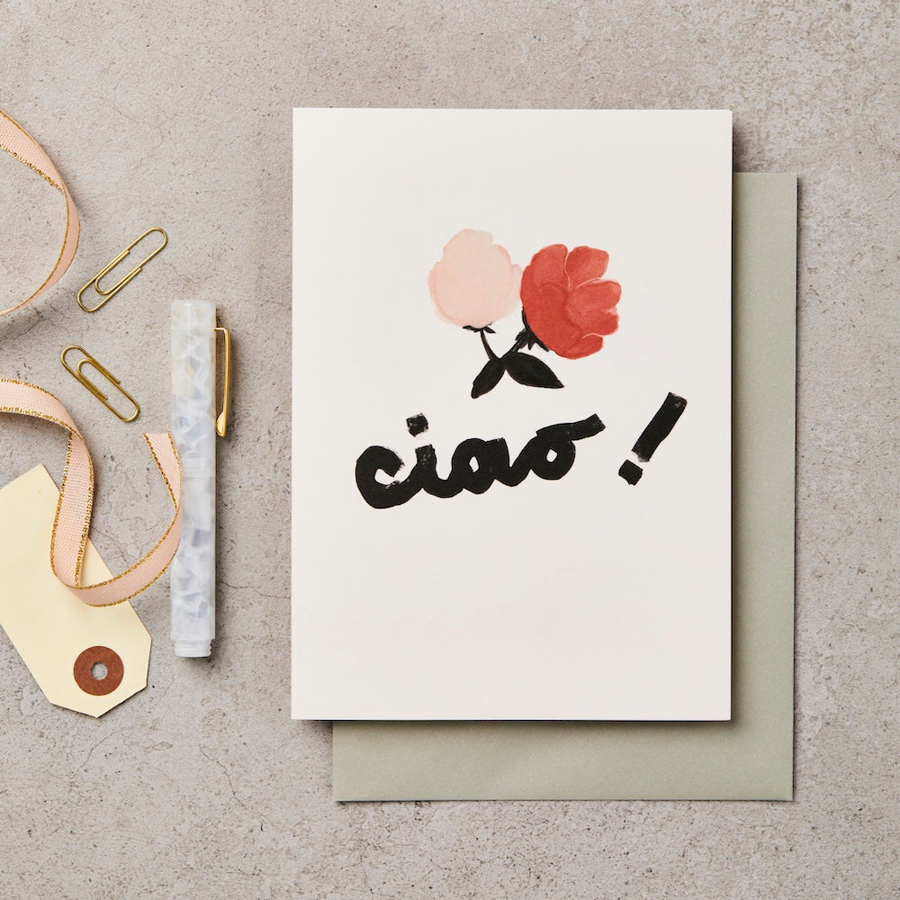 White cream coloured greetings card with Ciao Chiara design with a pink and a red flower with black petals ciao written in cursive black writing with an exclamation mark with a sage green envelope