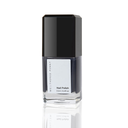 Clear glass rectangular shaped bottle of nail polish with dark midnight blue purple coloured nail polish black lid cream off white label with grey print WEATHERED PENNY Nail Polish 11 ml 0.4 fl oz