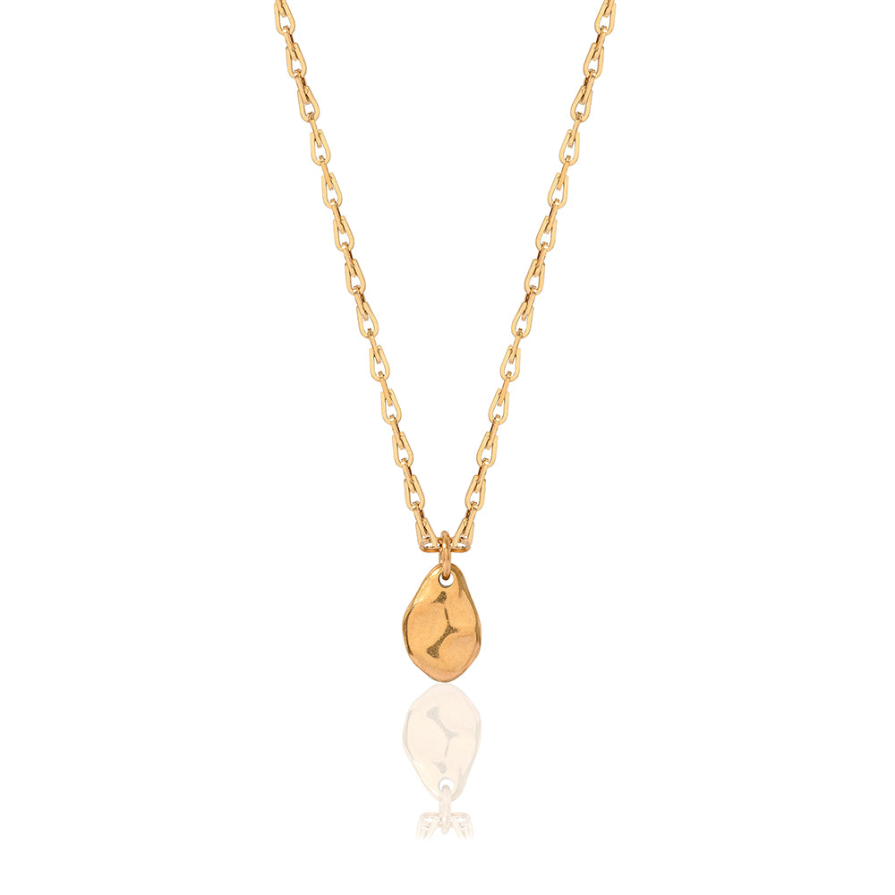 Gold linked chain necklace with oval shaped irregular smooth textured pendant 