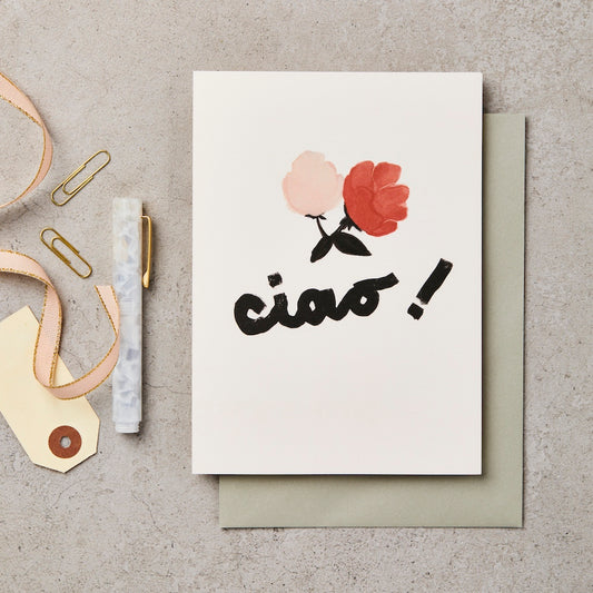 White cream coloured greetings card with Ciao Chiara design with a pink and a red flower with black petals ciao written in cursive black writing with an exclamation mark with a sage green envelope