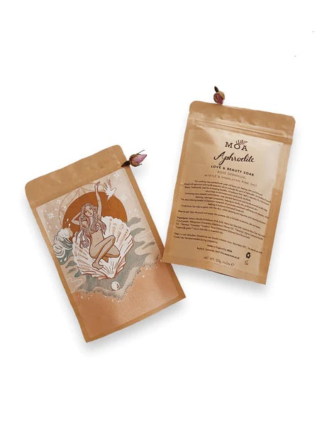 Brown paper bag of bath salts with goddess design