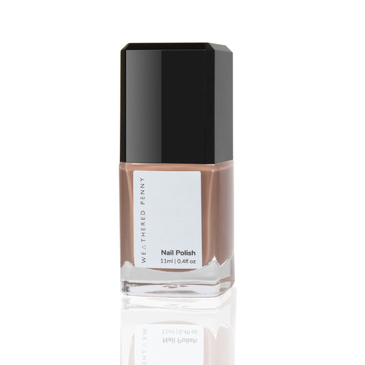 Clear glass rectangular shaped bottle of nail polish with nude dark blush coloured nail polish black lid cream off white label with grey print WEATHERED PENNY Nail Polish 11 ml 0.4 fl oz