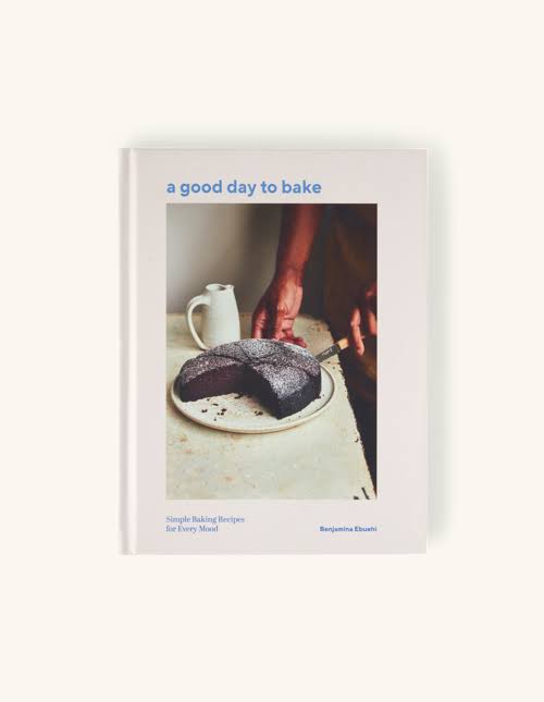 A good day to bake recipe book with image of half a chocolate cake and jug on outer cover