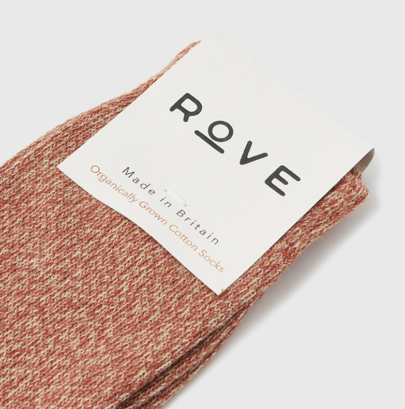 orange and cream speckled socks with white card with Rove printed in black