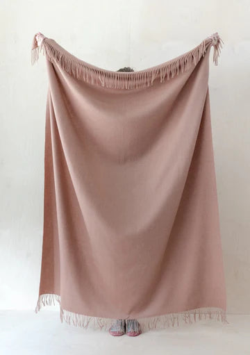 Blush pink muted lambswool blanket with tasseled top and bottom edges