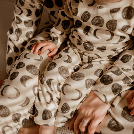 Kids pyjamas with black and white moon phases design 