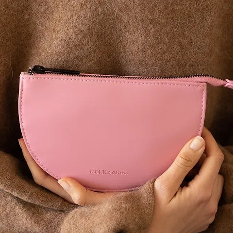 Two hand crossed holding pink wallet