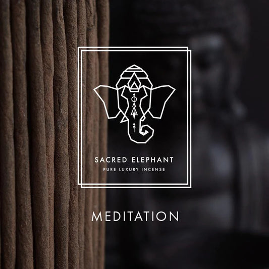 Incense sticks next to a print of an elephant head in white with the words Sacred Elephant pure luxury incense Meditation 