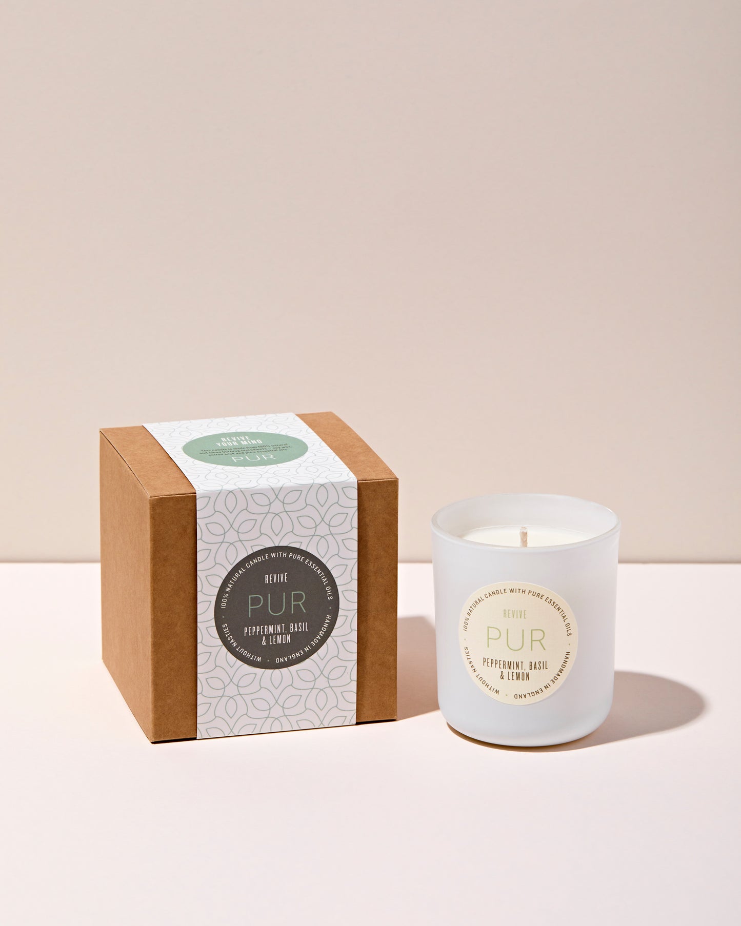 peppermint, basil and lemon candle in white glass with kraft box and green patterned sleeve