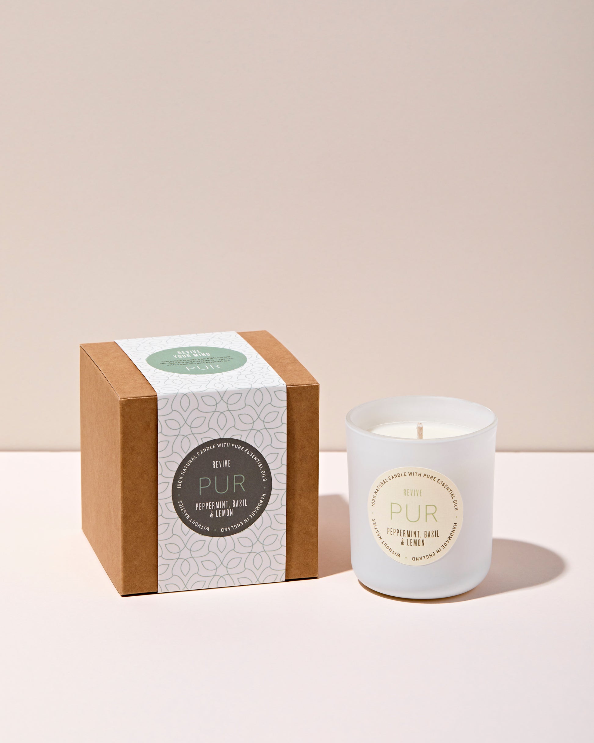 peppermint, basil and lemon candle in white glass with kraft box and green patterned sleeve